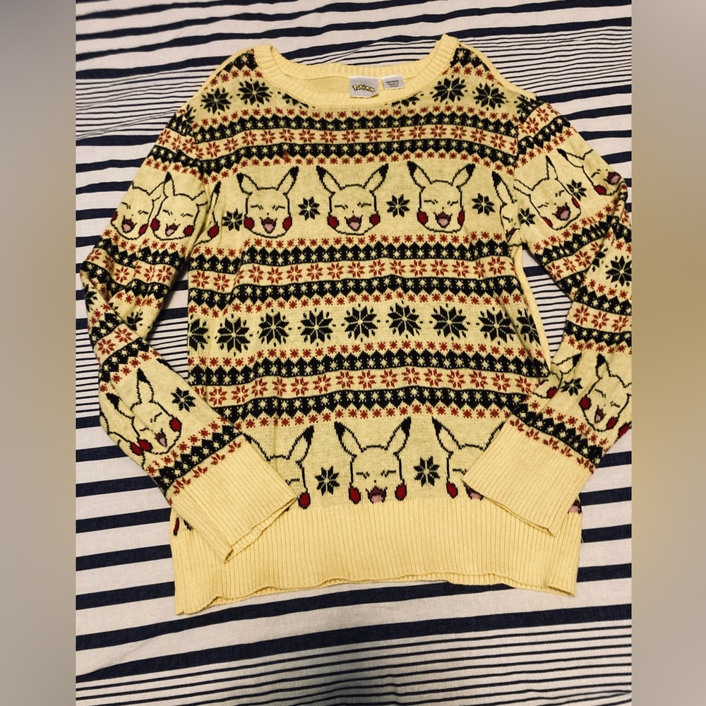 Boys Pokémon size medium Sweater yellow with pikachu 
Yellow Pikachu Sweater